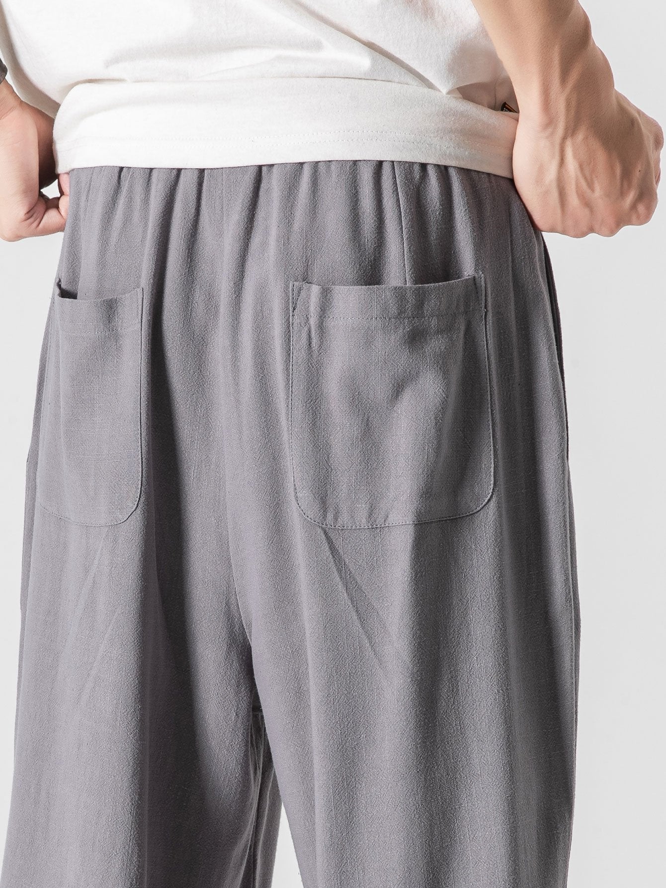 Men's trousers with a wide cut, elasticated waistband and drawstring 8